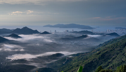 The sunrise on the high mountains, far away is the famous coastal tourist city of Nha Trang