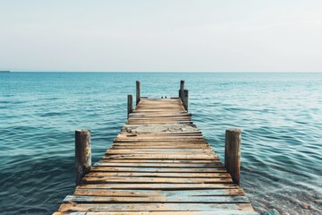 Fototapeta premium Pier. Old Wooden Dock Overlooking Calm Sea with Sunny Sky Day View