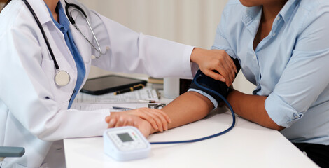 The doctor woman hand use the pulse meter to measure the pressure of the patient, medical checkup...