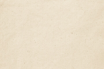 Closeup detail of beige fabric texture background. High resolution photo.