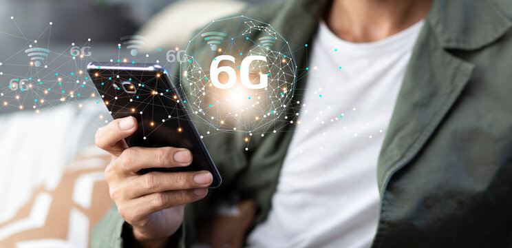 future technology 6G network internet of thinks connection communication  and man using smartphone at home - Powered by Adobe