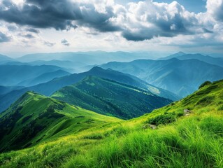 Fototapeta premium A breathtaking mountain landscape with rolling green hills and a dramatic sky filled with clouds, creating a serene and majestic scene.