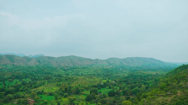 Rain clouds over lush green hills at Rayta, Rajasthan, India. Green landscape during monsoon season. Travel and holidays background. 