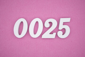 The numbers are made of white painted wood. Laying on the floor was pink paper.