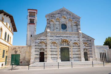 Fototapeta premium Beautiful Catholic church ¨Parrocchia di Santa Maria Ausiliatrice¨ in neo-Romanesque style in the town of Marina di Pisa, Italy
