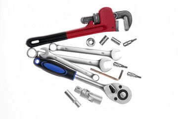 Set of auto mechanic's tools on white background, flat lay