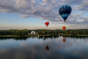 Aerial summer sunny view of hot air balloon over Galve lake in Trakai, Uzutrakis, Lithuania