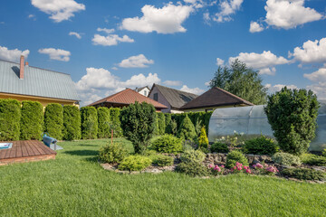 Naklejka premium greenhouse on the garden plot of a country house