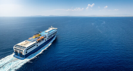 Aerial view of a big car carrier ship RO-RO (Roll on Roll off) cruising in mediterranean sea  with...