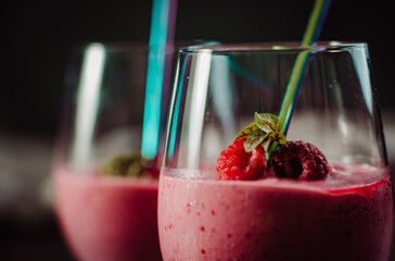 A delicious raspberry smoothie on a wooden table.