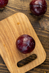 red ripe plum during cooking and slicing