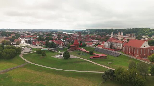 Aerial footage of Kaunas Castle (Kauno pilis) and the Old Town of Kaunas on a cloudy day, Lithuania