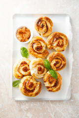 Puff pastry swirls with red pesto