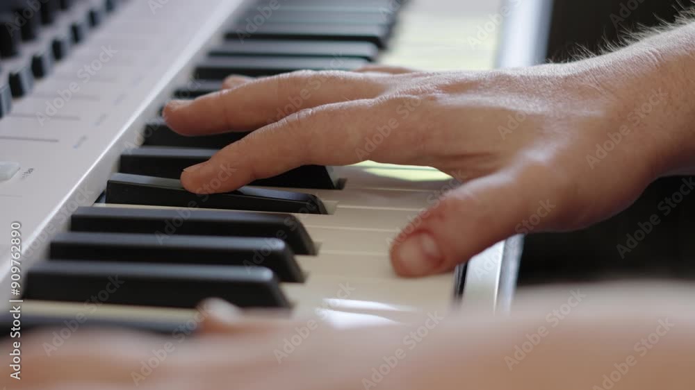 Poster male composer hands elegantly playing keyboard piano keys in different chords for recording session 