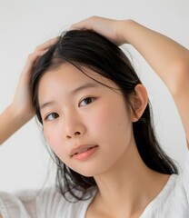 Fototapeta premium Portrait of a Young Asian Woman with Long Black Hair
