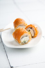 Sushi rolls with caramelized salmon