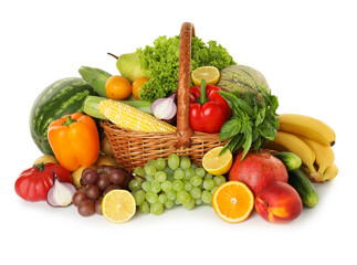 Different fresh fruits and vegetables in wicker basket isolated on white