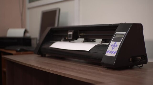 Plotter cutting. Cut out of paper. High-quality shooting in 4K format.