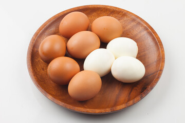 Eggs laid by chickens. It consists of egg shell, yolk, and white.