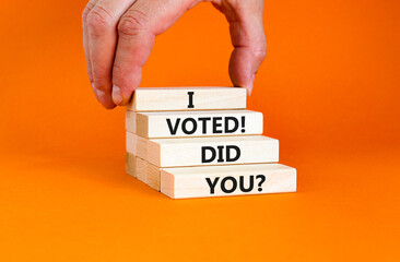 I voted. Did you symbol. Concept words I voted. Did you on beautiful wooden block. Beautiful orange table orange background. Voter hand. Business I voted. Did you concept. Copy space.