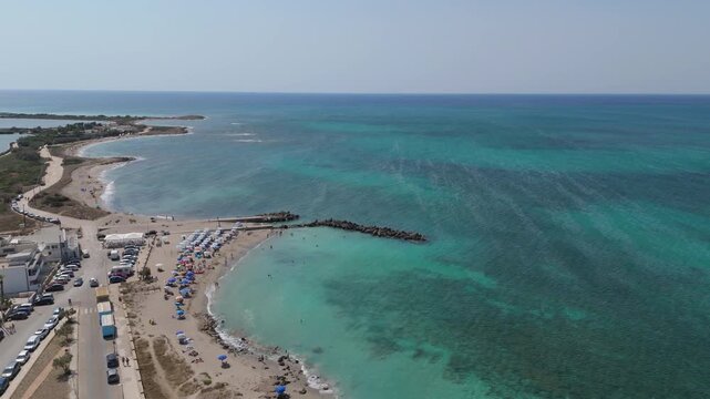 Torre Mozza is a coastal town in Salento, Puglia, known for its white sandy beaches and crystal-clear waters. The 17th-century tower, from which it takes its name, overlooks the scenic coastline