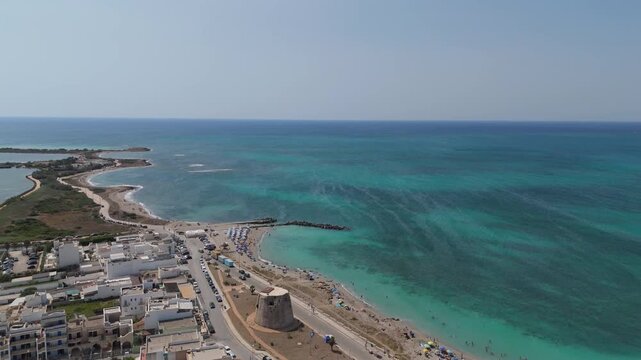 Torre Mozza is a coastal town in Salento, Puglia, known for its white sandy beaches and crystal-clear waters. The 17th-century tower, from which it takes its name, overlooks the scenic coastline