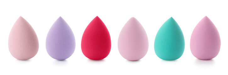 Set with makeup sponges of different colors isolated on white