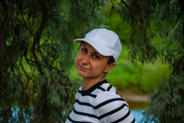 Woman sitting on the tree. High quality photo