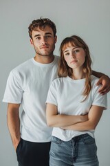 Fototapeta premium Mock up of a male and female couple wearing plain white t-shirts, AI generated Image