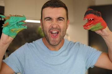 Cute adult playing with plastic dinosaurs 