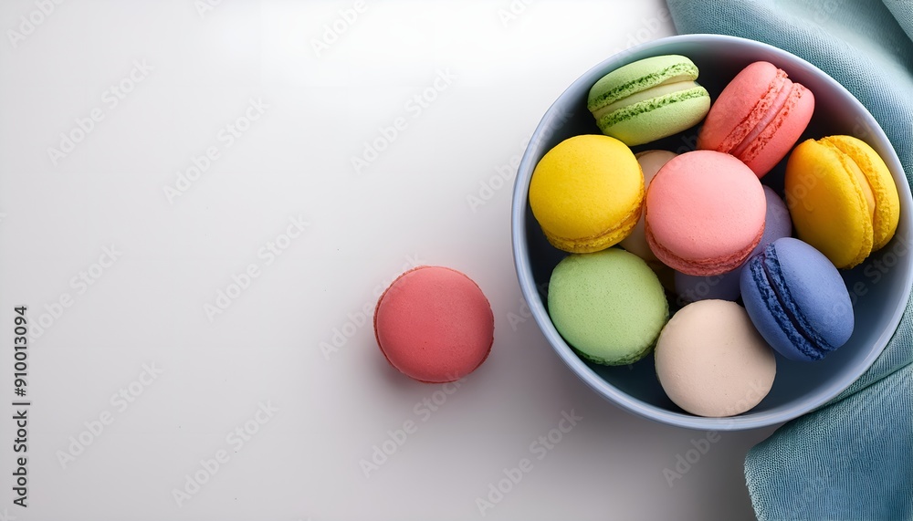 Aufkleber top view multi color macarons in bowl on white background