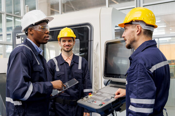 head technician engineer consulting and discussing operations new machine technology  to work in production line to factory worker. group of industrial worker talking and relax with friends.