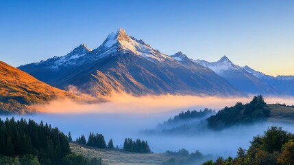 Stunning Snow-Capped Mountain Peaks Bathed in Golden Sunrise Light, Illuminated Summit with Clear Sky and Tranquil Valley Shrouded in Morning Mist