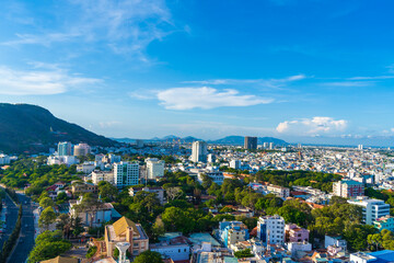 Panoramic view of Vung Tau sea from above with waves, coastline, streets, coconut trees and Tao Phung mountain in Vietnam. Travel concept