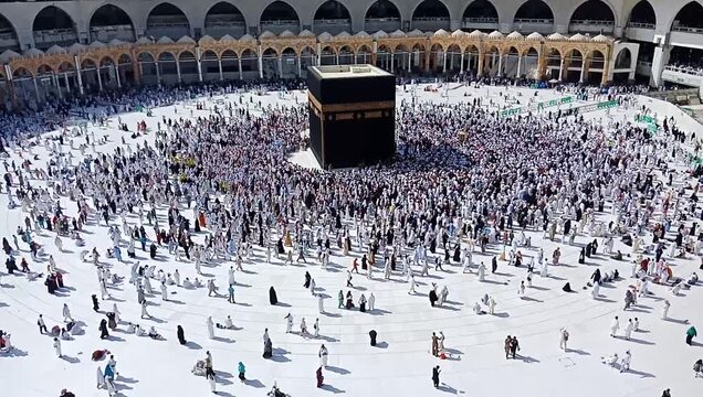 Muslim people praying at Kaaba in Mecca