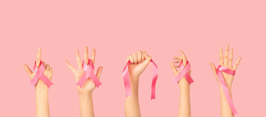 Breast Cancer Awareness Month in October. Group of women hands holding satin pink ribbon awareness to support and fight for health. Breast cancer screening and prevention campaign banner.