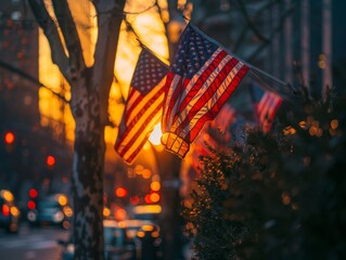 American flags hanging from city trees, backlit by the warm glow of a sunset, with blurred urban lights creating a picturesque backdrop.
