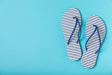Flip flops on a bright colored background. Sandals. Summer Slippers. Vacation Concept. Rubber Slide Sandal . Top view. Space for text. Copy space