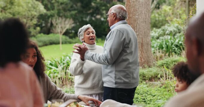 Senior, couple and dancing in garden at family reunion for celebration together with fun. Happy woman, outdoor and smile with holding hands, care and love in backyard at anniversary party and event