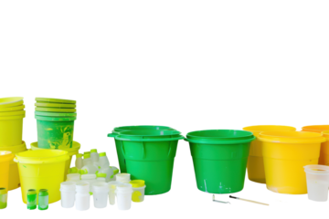 Paint rollers and buckets on white background.