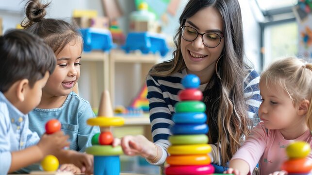 Teacher with children playing colorfully in kindergarten