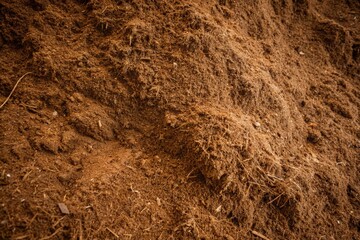 A pile of sawdust and wood chips in the lumber industry. - stock photo