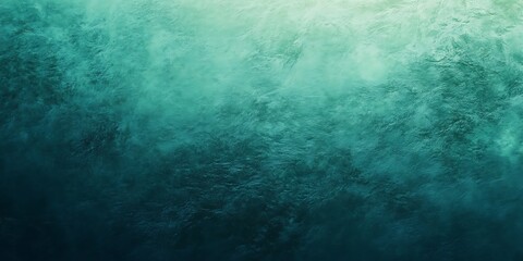 Obraz premium Abstract blue and teal textured background with a gradient effect.