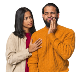 Young Latino couple in studio having a strong teeth pain, molar ache.