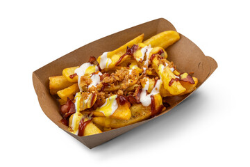 Golden French fries potatoes with ketchup isolated on a white background.