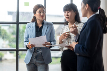 Businesswomen having meeting discussing documents in office