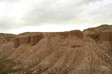 Dramatic Clouds Over Arid Canyon Landscape