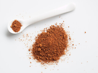 Coconut Blossom Sugar and Porcelain Spoon on White Background