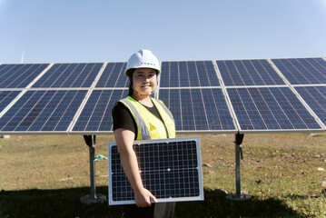 female technician working in solar power station