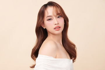 Beautiful young asian woman with clean fresh skin on beige background, Face care, Facial treatment, Cosmetology, beauty and spa, Asian women portrait.